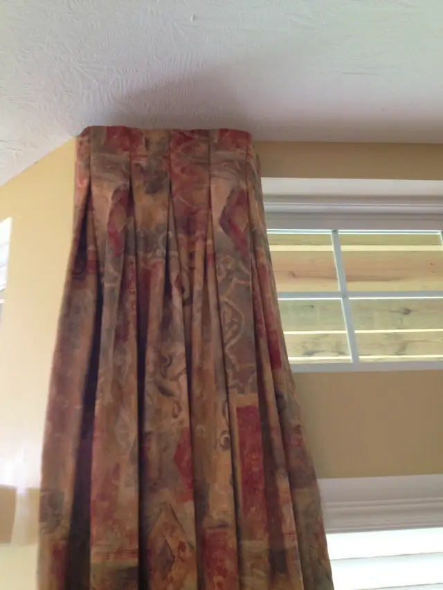 Pleated floral drapery on a pole